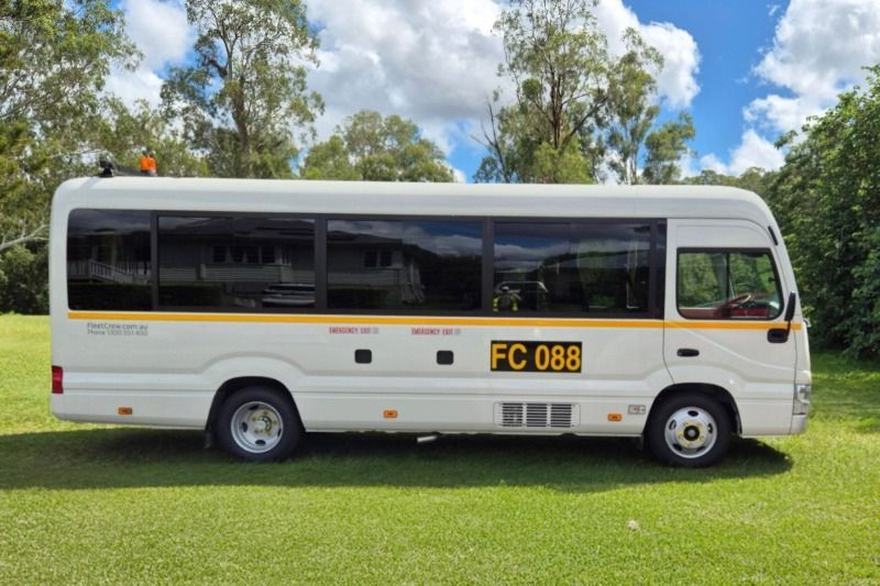 22 seater Toyota Coaster Bus profile view