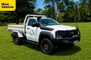Mine Spec Ford Ranger Super Duty Single Cab in a green field
