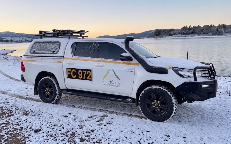 LandCruiser Prado 250 Series parked in the snow with ski racks