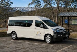 FleetCrew 2WD 12 seat commuter bus parked in a national park